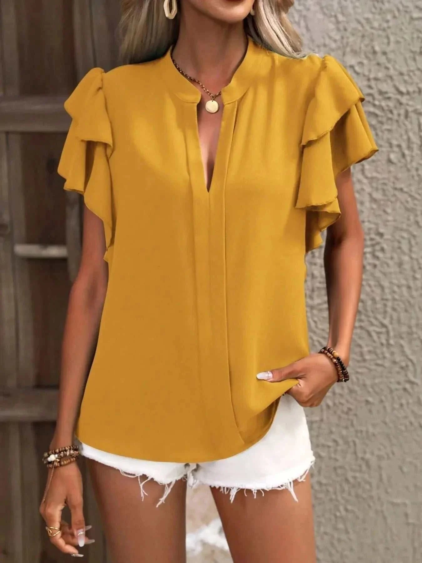 Mustard yellow ruffle sleeve notched blouse with short flutter sleeves and v-neck front.