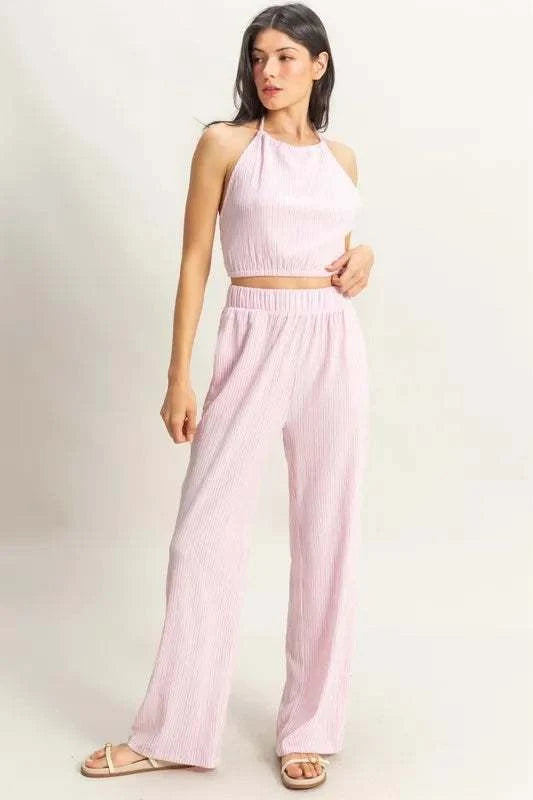 Woman wearing HYFVE Striped Halter Neck pink striped top and matching pants set