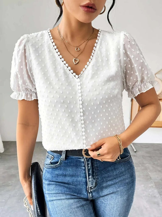 White Swiss dot short sleeve blouse with ruffled edges and button front detail