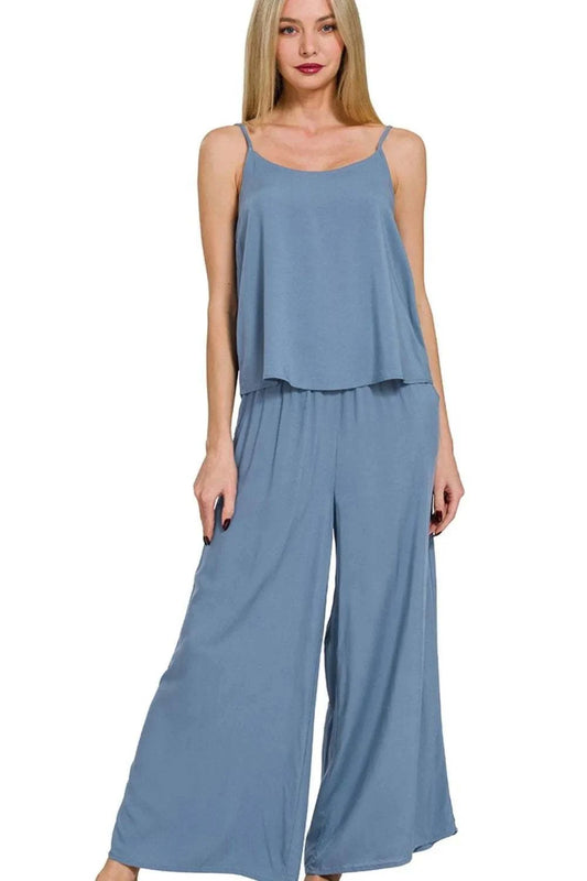 Woman wearing Zenana Woven Cami & Pants Set in soft blue with flowing cami top and wide-leg palazzo pants.