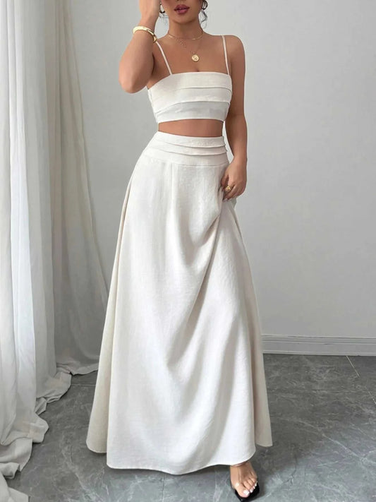 Woman wearing white square neck cami top and matching ruched maxi skirt set