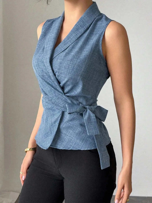 Sleeveless blue tied surplice top with bow detail in polyester fabric