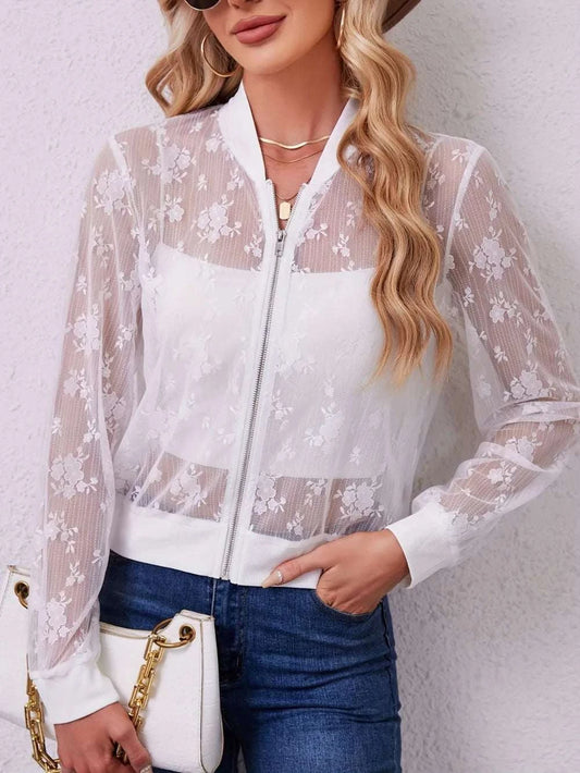 White lace baseball collar zip-up jacket with sheer floral sleeves and front, styled with denim jeans and a handbag.